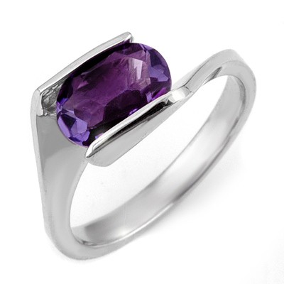 Solitaire 2.0ctw Amethyst Ring White Gold: Lot no.: 1663 GENUINE SOLITAIRE 2.00 ctw AMETHYST LADIES RING IN 10KT WHITE GOLDGEMSTONE: 1 OVAL CUT AMETHYST 2.00 ctw GOLD WEIGHT: APPROXIMATELY 3.60 GRAMSSIZE: 6 1/2DIMENSIONS: APPROX. 3/8" X 1/2"