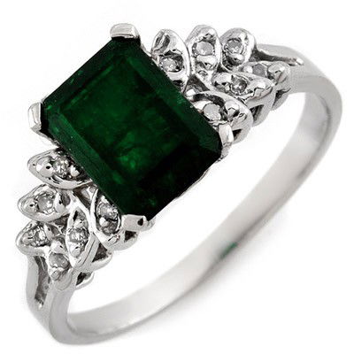 Genuine 2.12ctw Diamond & Emerald Ring White Gold: Lot no.: 1687 GENUINE 2.12 ctw DIAMOND & EMERALD LADIES RING IN 10K WHITE GOLDGEMSTONE: 1 EMERALD CUT EMERALD 2.00 ctwDIAMOND: 12 ROUND CUT 0.12 ctwCLARITY: SI2-I1COLOR: H-KGOLD WEIGHT: APPROXIMATELY
