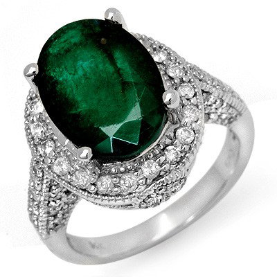 Genuine 6.50 ctw Emerald & Diamond Ring 14K White Gold : Diamond: 86 Round cut @ 1.0 ctw Clarity: SI-I Color: H-KGemstone: Natural EmeraldGemstone color: GreenGemstone quality: Good-to-Very GoodGemstone Cut & Weight: 1 Oval cut @ 5.50 ctwMetal Purity & Colo