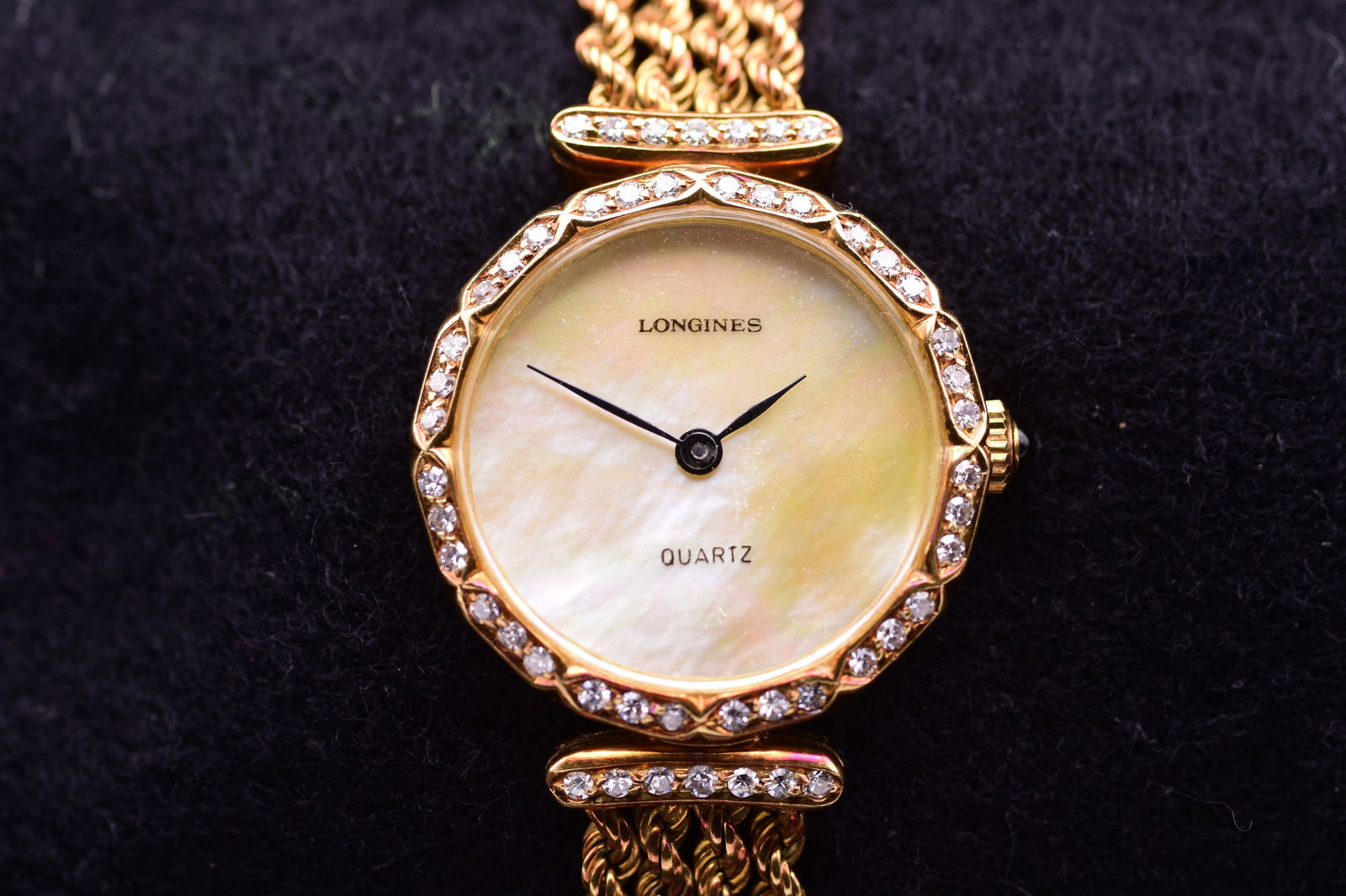 Longines Ladies18k Yellow Gold Factory Diamond Set Mother Of Pearl Dial Dress Watch: Longines Ladies18k Yellow Gold Factory Diamond Set Mother Of Pearl Dial Dress Watch An elegant Longines ladies quartz watch, 18k Yellow Gold, featuring a diamond-set bezel, a mother-of-pearl dial, and