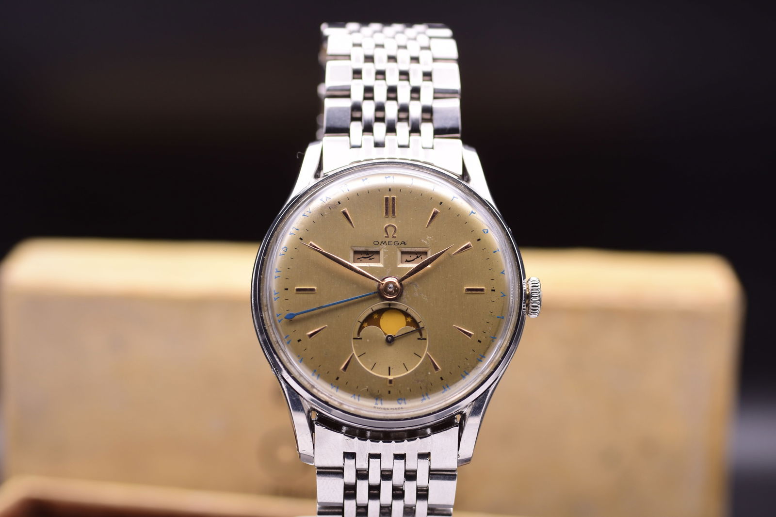 Omega Cosmic: A Fine and Rare Triple Calendar Wristwatch with Moon Phase Arabic Ref. 2471 C.1950: Omega Cosmic: A Fine and Rare Triple Calendar Wristwatch with Moon Phase Arabic Ref. 2471 C.1950 A striking and historically significant timepiece, this Omega Cosmic Triple Persian (Farsi) Arabic Date