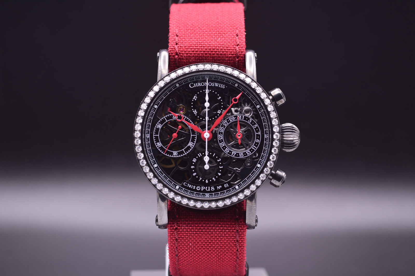 Chronoswiss: A Skeletonized Automatic Chronograph with Factory Diamond Bezel and Red Strap,: Chronoswiss: A Skeletonized Automatic Chronograph with Factory Diamond Bezel and Red Strap, Extremely Rare 'N°01' Of Limited Edition Ref. C.7415 Model Opus, C.1995 Including Box and Papers This exqui