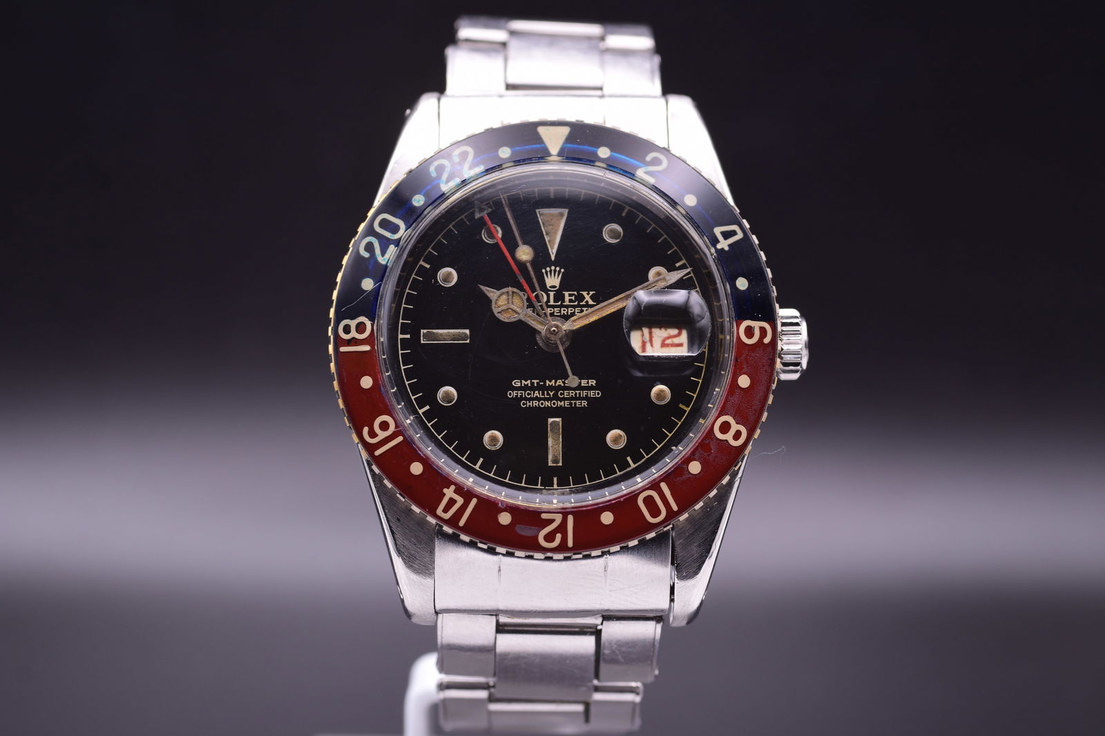 Rolex, GMT-Master, Ref 6542 A Highly Important Stainless Steel Dual Time Zone Wristwatch with Date,: Rolex, GMT-Master, Ref 6542 A Highly Important Stainless Steel Dual Time Zone Wristwatch with Date, Bakelite Bezel, The Original James Bond "Pussy Galore", C.1958 Including Box A superb example of an