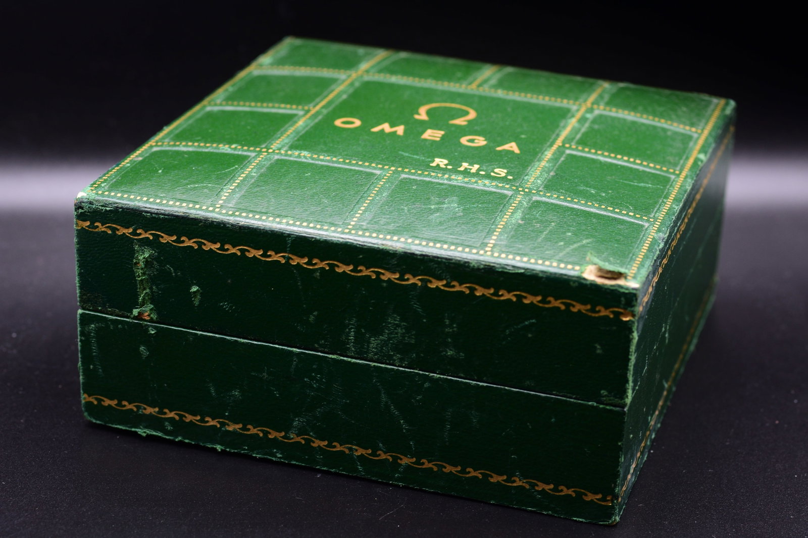 Double-Signed Omega & Spritzer & Fuhrmann Seamaster Watch Box: Double-Signed Omega & Spritzer & Fuhrmann Seamaster Watch BoxOmega Seamaster presentation box features a distinctive green "waffle" patterned faux-leather exterior accented with gold-dot detailing