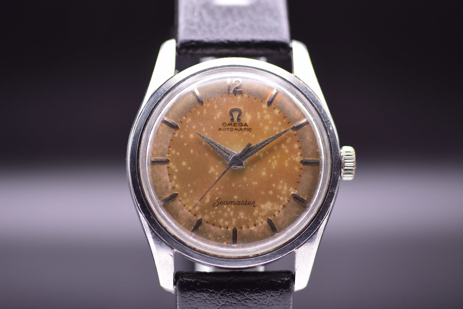 Omega Seamaster Automatic 2869 1 SC Mottled Golden Leopard Patina Dial 1955: Title: Omega Seamaster Automatic 2869 1 SC Mottled Golden Leopard Patina Dial 1955 Catalogue Description: A vintage stainless steel automatic wristwatch circa 1955. Features a thirty four millimetre s