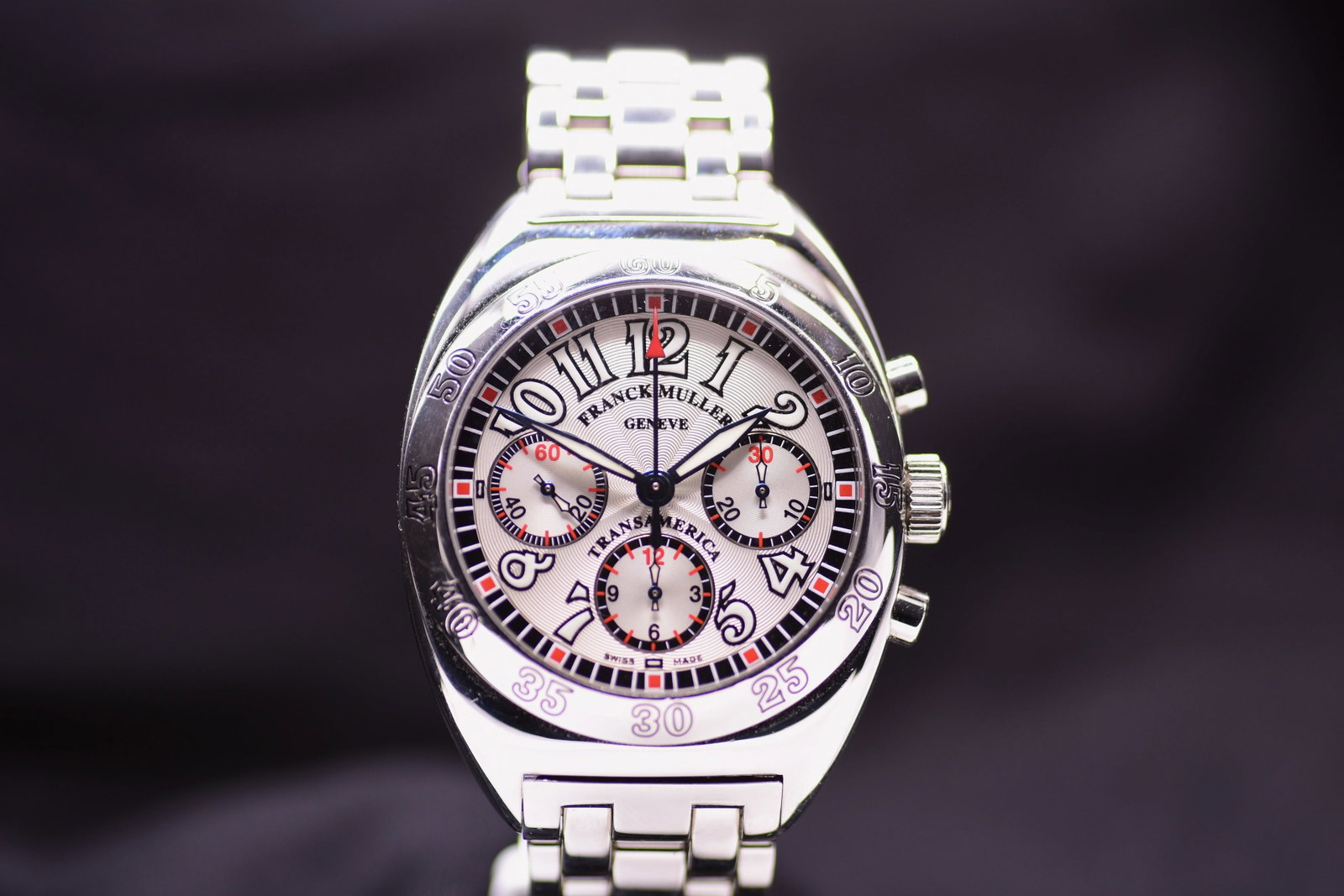 Franck Muller Transamerica Automatic Chronograph 2000 CC AT Silver Guilloche Dial Exploded Arabic: Title: Franck Muller Transamerica Automatic Chronograph 2000 CC AT Silver Guilloche Dial Exploded Arabic Numerals 2000 Catalogue Description: A contemporary stainless steel automatic chronograph brace
