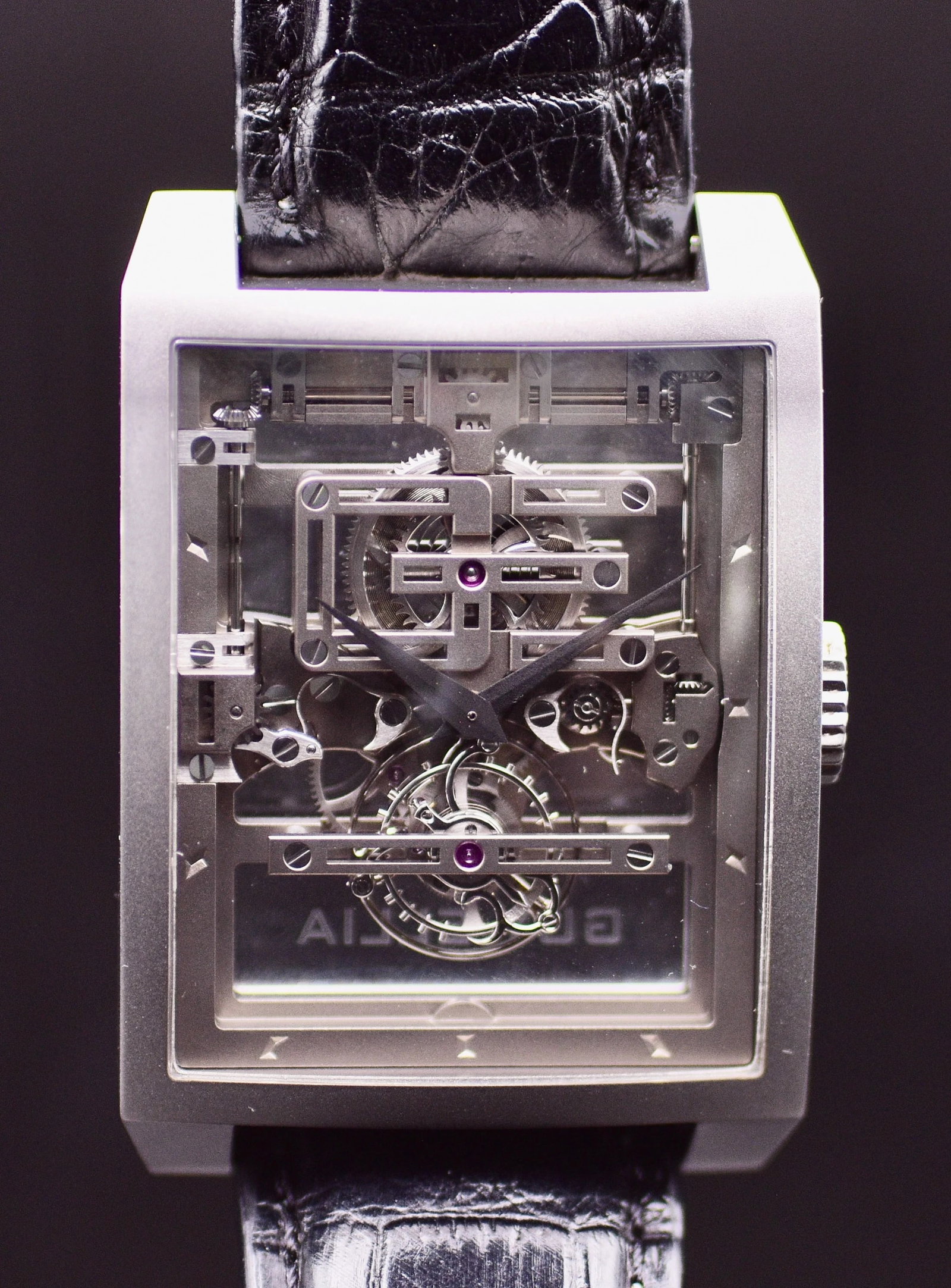 Guy Ellia Magistere Tourbillon OG TS 2311 BICONVEX Skeleton Dial Grade 5 Titanium 2008: Title: Guy Ellia Magistere Tourbillon OG TS 2311 BICONVEX Skeleton Dial Grade 5 Titanium 2008 Catalogue Description: An ultra exclusive and rare rectangular biconvex titanium manual wind skeleton flyi