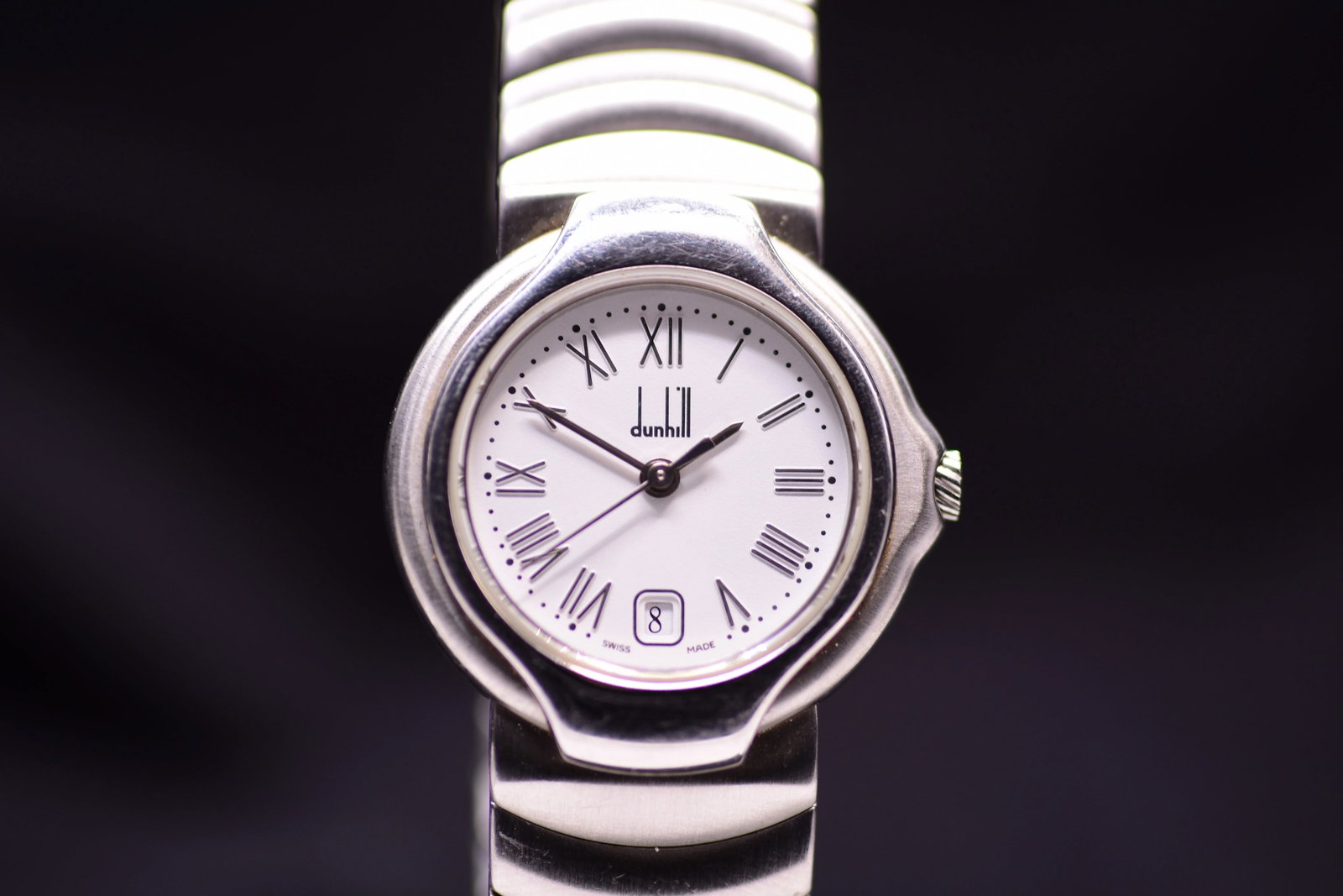 Dunhill Millennium 8000 TB MC Matte White Dial Elongated Roman Numerals 1990: Title: Dunhill Millennium 8000 TB MC Matte White Dial Elongated Roman Numerals 1990 Catalogue Description: A lady stainless steel quartz wristwatch circa 1990. Features a compact twenty six millimetre