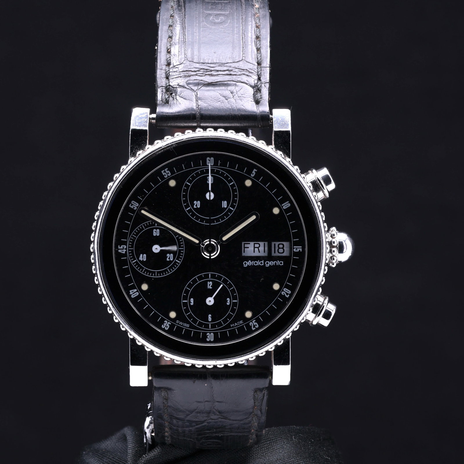 Gerald Genta Gefica Chronograph G.3484.7 Year 1990 Matte Black Dial Double Stepped Bezel Bead: Title: Gerald Genta Gefica Chronograph G.3484.7 Year 1990 Matte Black Dial Double Stepped Bezel Bead Accents Catalogue Description: A rare and avant garde gentlemans stainless steel automatic day date
