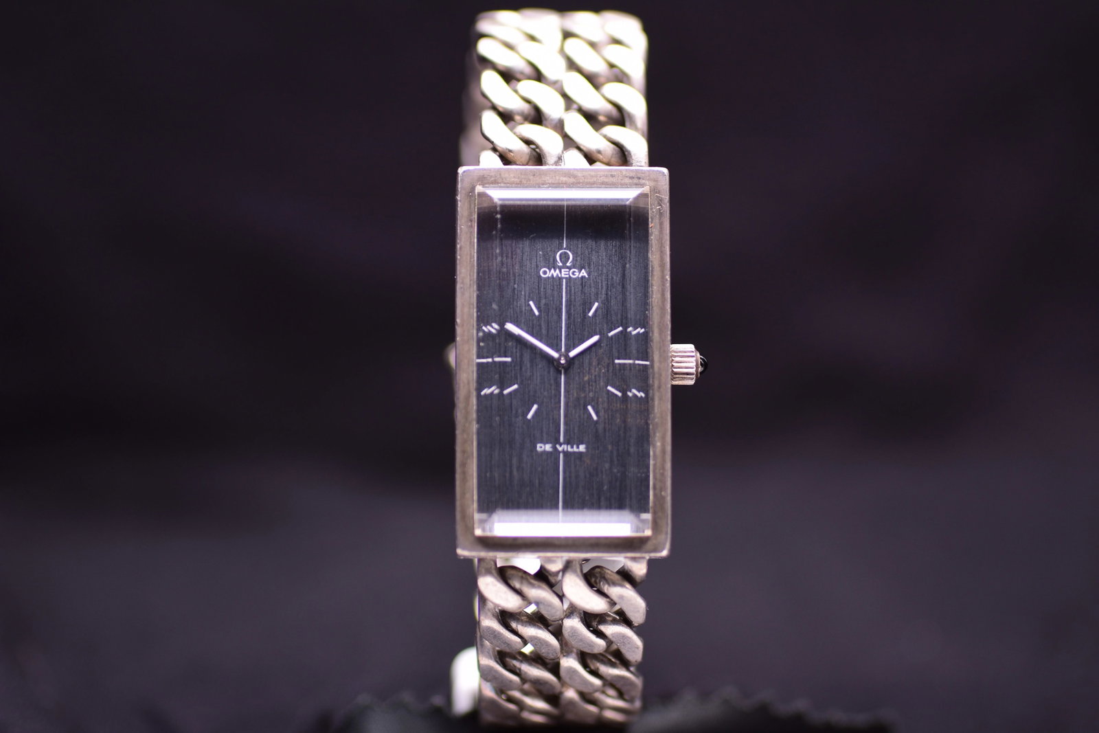 Omega De Ville 711.1804 Solid Silver Integrated Gourmette Curb Link Bracelet Blue Cabochon Crown: Title: Omega De Ville 711.1804 Solid Silver Integrated Gourmette Curb Link Bracelet Blue Cabochon Crown 1974 Catalogue Description: A rare solid silver manual wind wristwatch produced circa 1974. Feat
