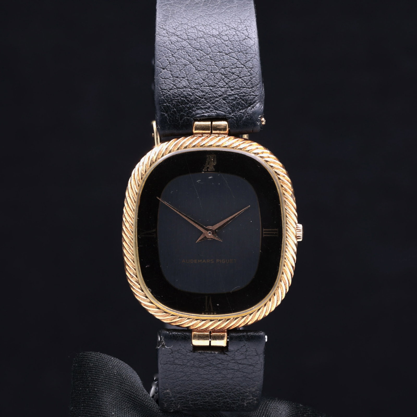 Audemars Piguet Cobra Ellipse 5413 18ct Yellow Gold Twisted Gadroon Bezel Matte Black Dial 1980: Title: Audemars Piguet Cobra Ellipse 5413 18ct Yellow Gold Twisted Gadroon Bezel Matte Black Dial 1980 Catalogue Description: A rare and elegant gentlemans eighteen carat yellow gold manual winding dr