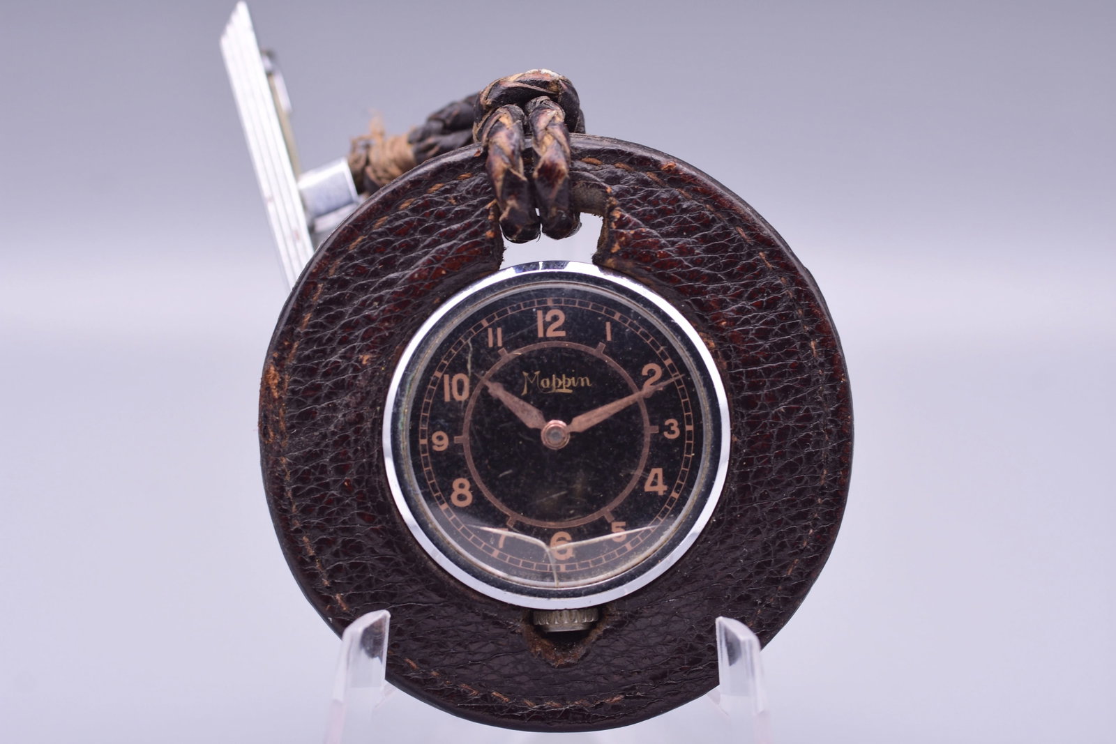Mappin and Webb Buttonhole Pocket Watch Cyma Movement Black Sector Dial Leather Toggle 1935: Title: Mappin and Webb Buttonhole Pocket Watch Cyma Movement Black Sector Dial Leather Toggle 1935 Catalogue Description: A highly distinctive Art Deco period sporting or buttonhole pocket watch retai