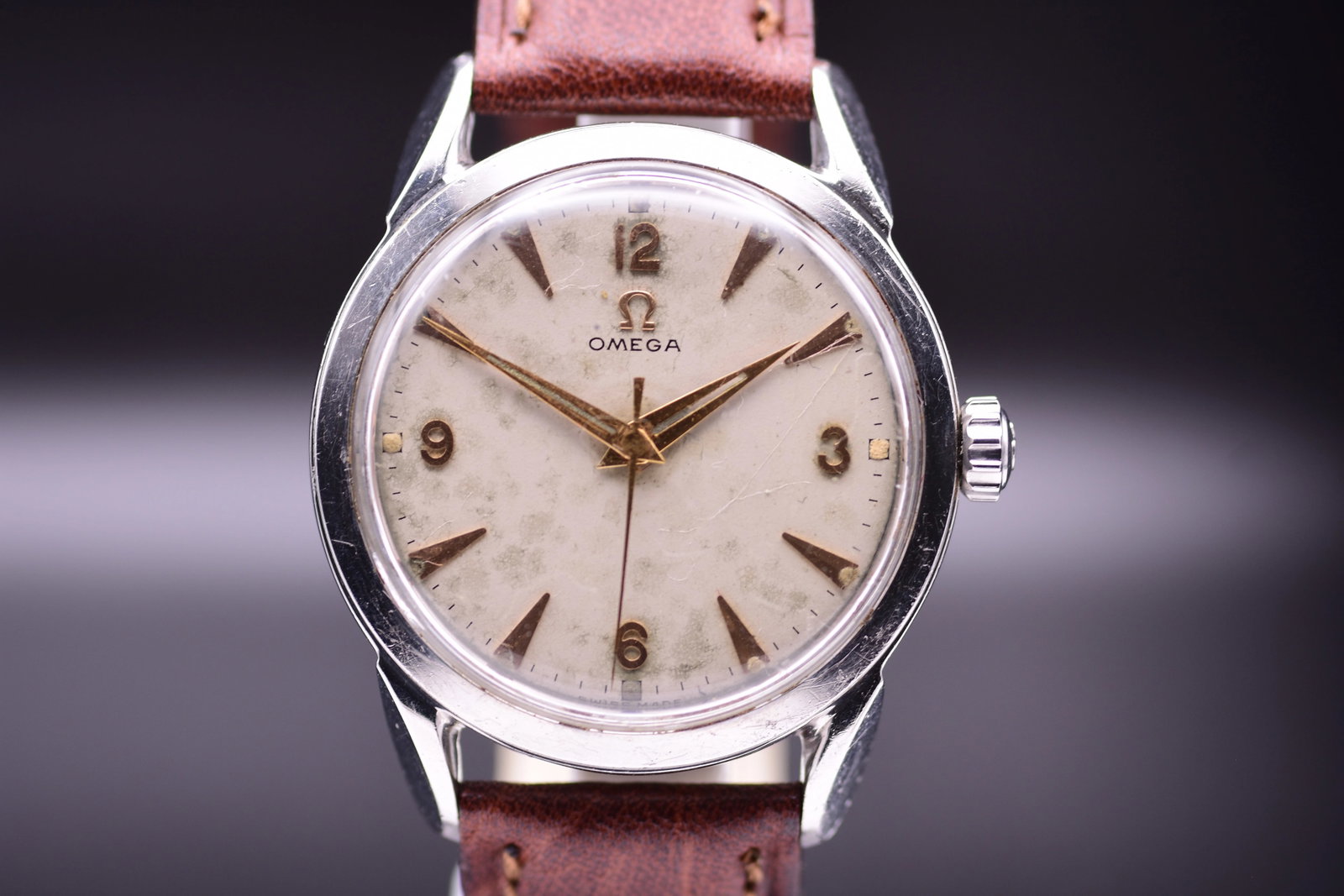 Omega Rhino Ears Stainless Steel Wristwatch Ref. 2715-1 SC Cream Dial 1953: Title: Omega Rhino Ears Stainless Steel Wristwatch Ref. 2715-1 SC Cream Dial 1953 Catalogue Description: Omega Reference 2715-1 SC crafted in stainless steel, featuring a 34.5mm case with sculptural, 