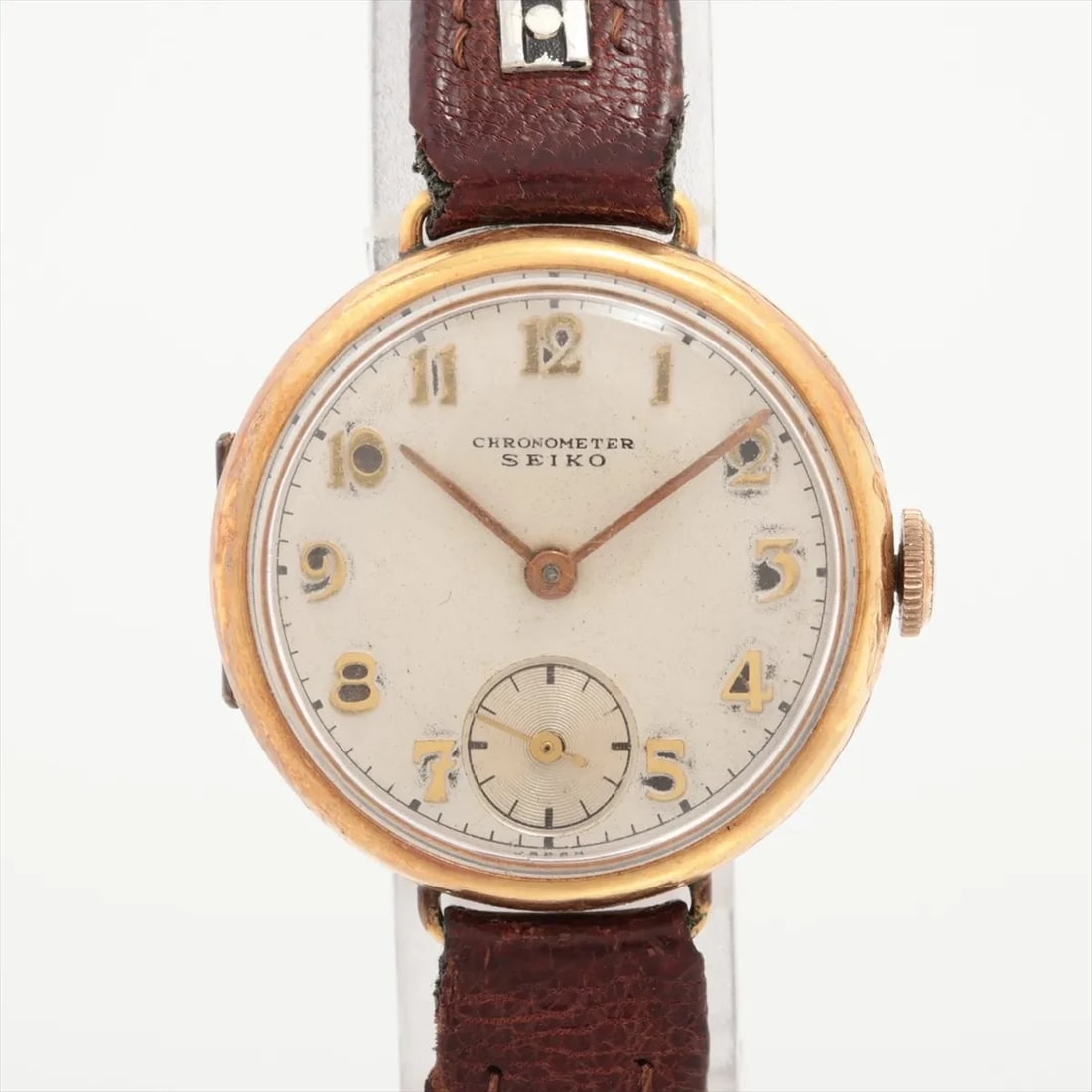 Seiko Chronometer 18k Gold Filled Wristwatch Silver Dial Snap Back Case KKS 1940s: Title: Seiko Chronometer Gold Plated Wristwatch Silver Dial Snap Back Case 1940s Catalogue Description: Seiko Chronometer vintage wristwatch featuring a 26mm gold plated round case with a plain polish