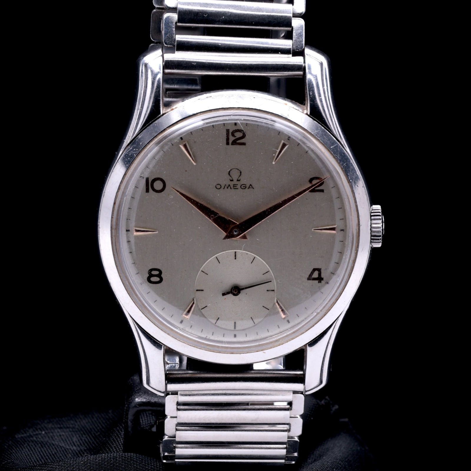Omega Dress Watch 2488-1 1947 Two Tone Sub Second Dial: Title: Omega Dress Watch 2488-1 1947 Two Tone Sub Second Dial Catalogue Description: A manual wind stainless steel dress wristwatch. The silvered two tone dial features applied copper toned alternatin