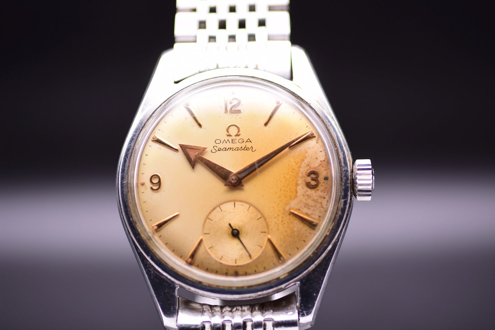 Omega Seamaster Seachero 2990-1 1961 Tropical Dial: Title: Omega Seamaster Seachero 2990-1 1961 Tropical Dial Catalogue Description: A manual wind stainless steel sports wristwatch. The rare tropical dial features a naturally aged warm amber split colo