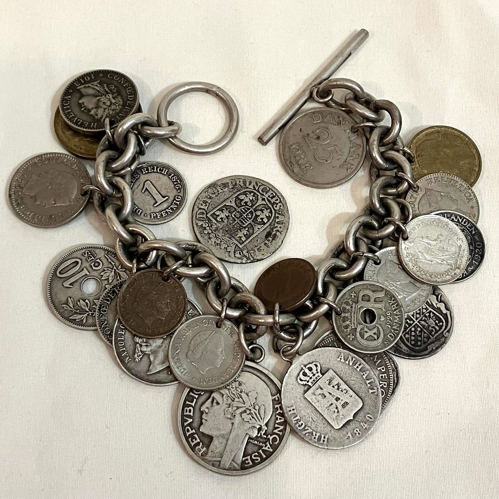 Coin and Token Charm Bracelet - Some Sterling Silver - Approx 7": Coin and Token Charm Bracelet - Some Sterling Silver - Approx 7"