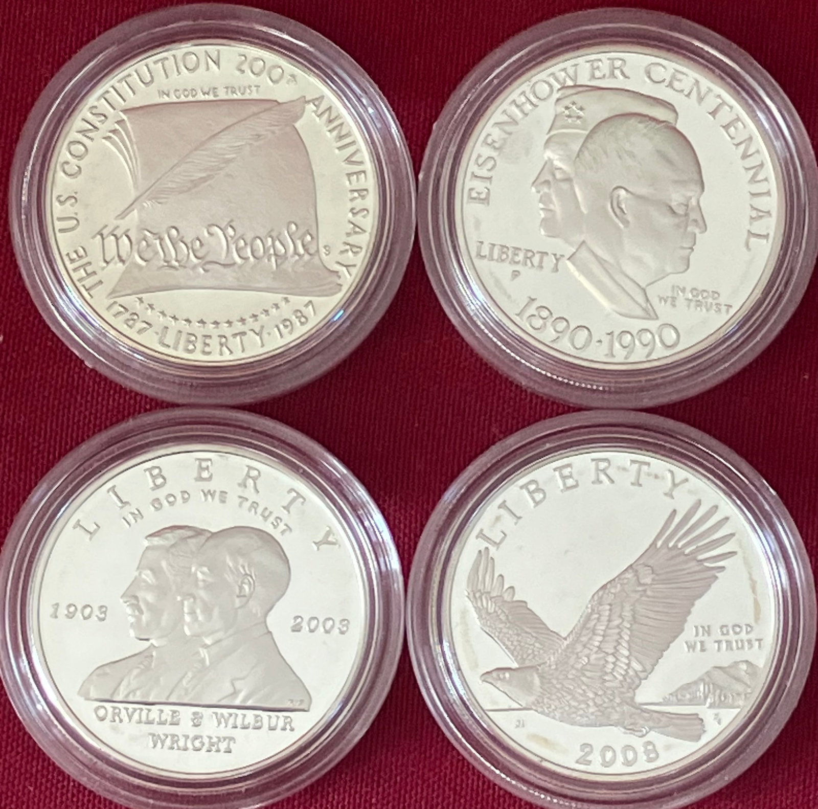 Four Commemorative Silver Dollars - 1987-S Constitution, 1990-P Eisenhower, 2003-P First Flight, (1 of 3)