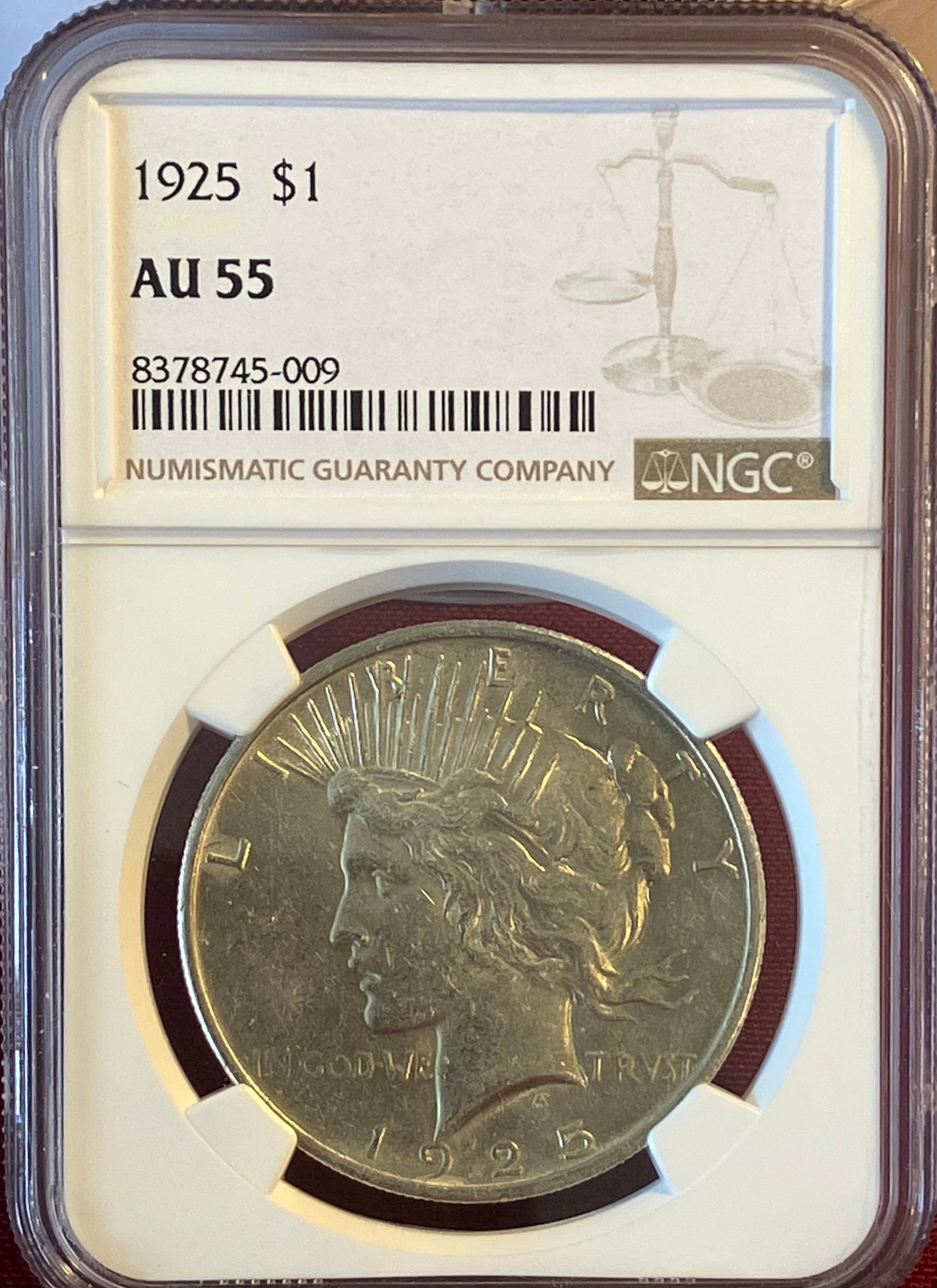Graded 1925 Peace Silver Dollar - AU55 by NGC: Graded 1925 Peace Silver Dollar - AU55 by NGC
