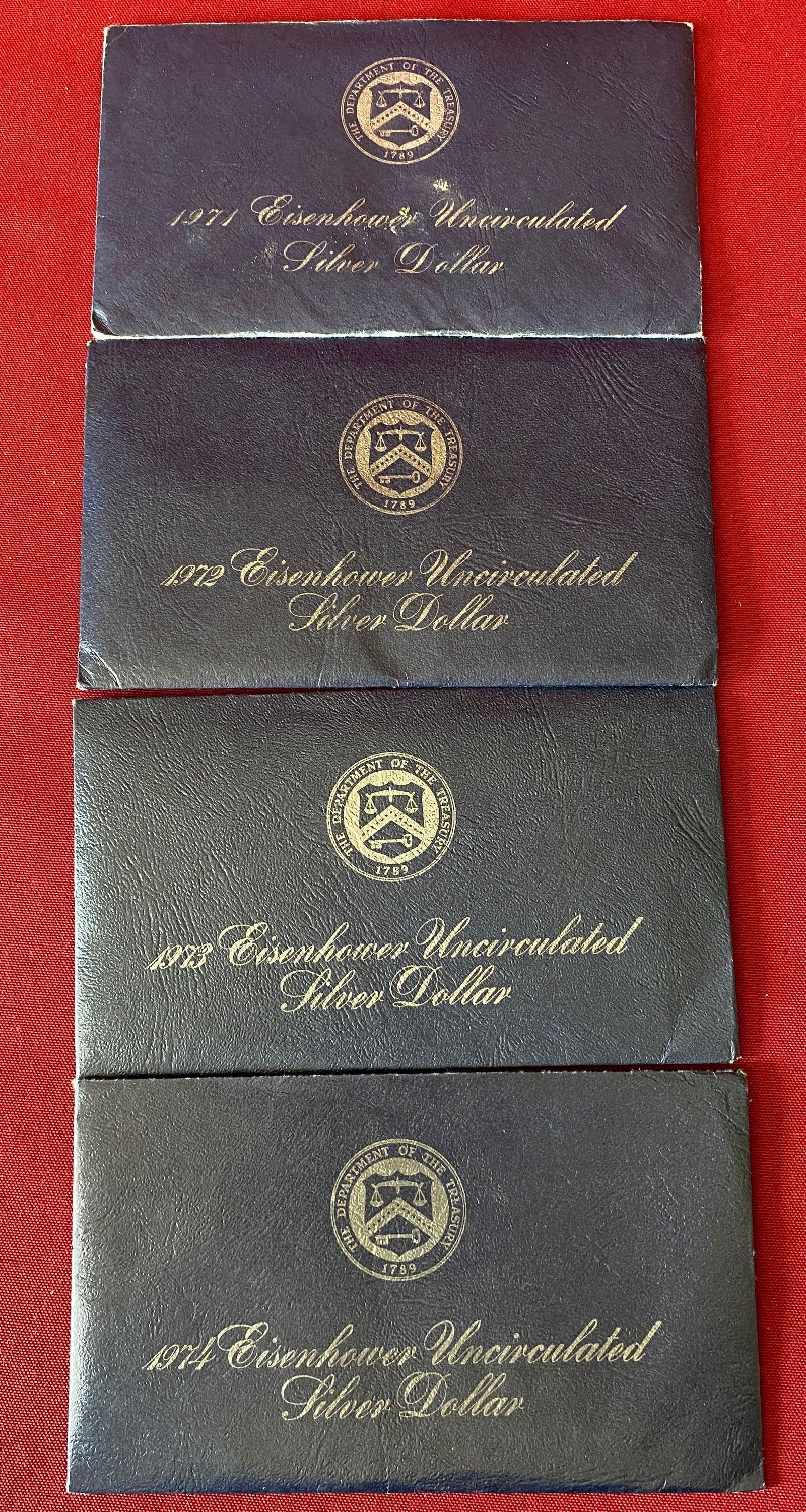 Four Eisenhower Uncirculated Silver Dollars - 1971-1974 (1 of 3)