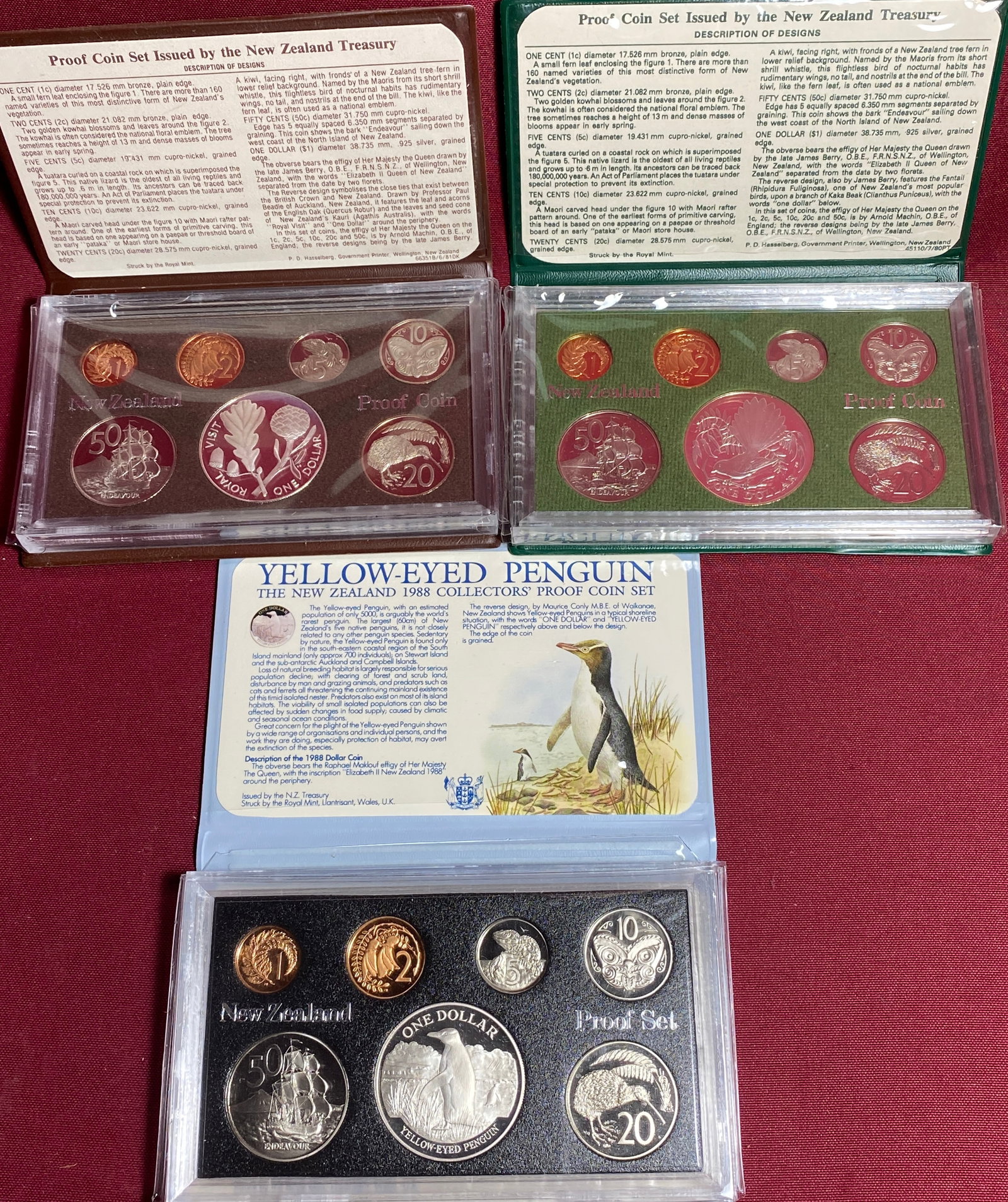 Three New Zealand Proof Coin Sets - Each with .925 Silver Dollar - 1980, 1981, 1988: Three New Zealand Proof Coin Sets - Each with .925 Silver Dollar - 1980, 1981, 1988