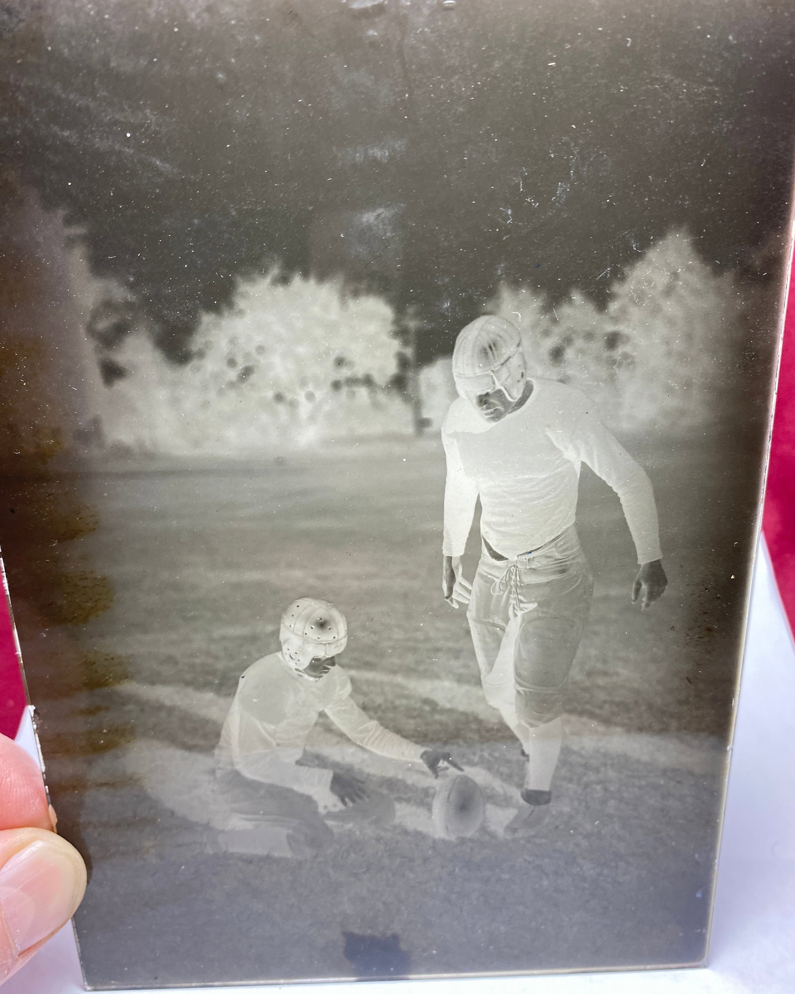 Antique Glass Photograph of Football Kicker and Holder in Action: Antique Glass Photograph of Football Kicker and Holder in Action