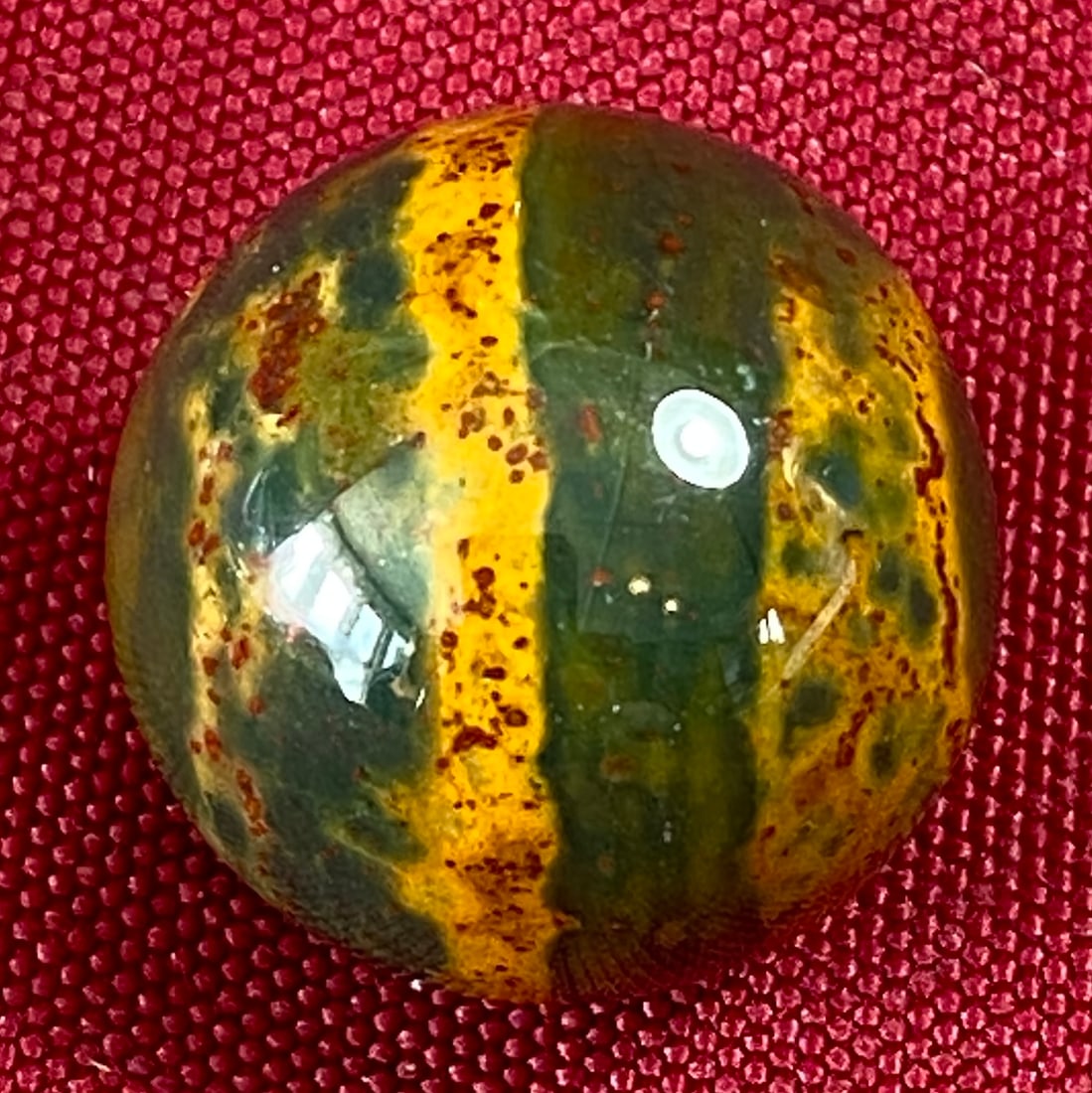 Collectible Marble with Greens, Yellows, and Reds (1 of 5)