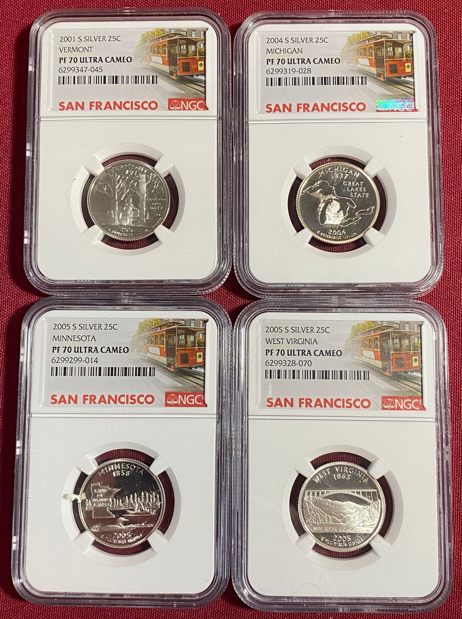 Four NGC Graded PF70 Ultra Cameo U.S. Silver State Quarters ? 2001-S Vermont, 2004-S Michigan,: Four NGC Graded PF70 Ultra Cameo U.S. Silver State Quarters ? 2001-S Vermont, 2004-S Michigan, 2005-S West Virginia, 2005-S Minnesota