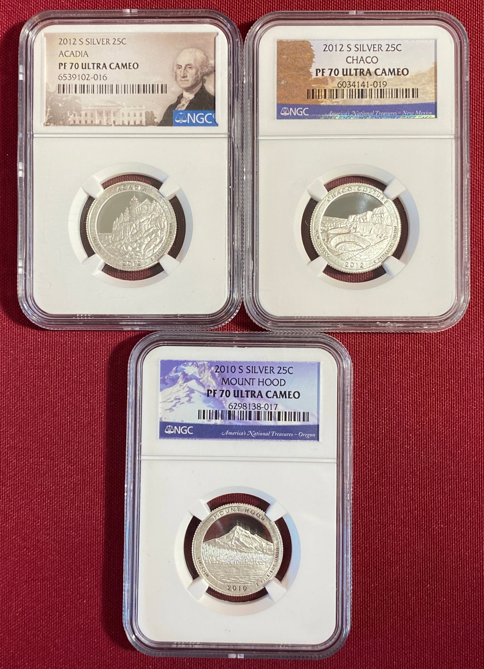 Three NGC Graded PF70Ultra Cameo U.S. National Parks Silver Quarters - 2010-S Mount Hood, 2012-S: Three NGC Graded PF70Ultra Cameo U.S. National Parks Silver Quarters - 2010-S Mount Hood, 2012-S Acadia, 2012-S Chaco