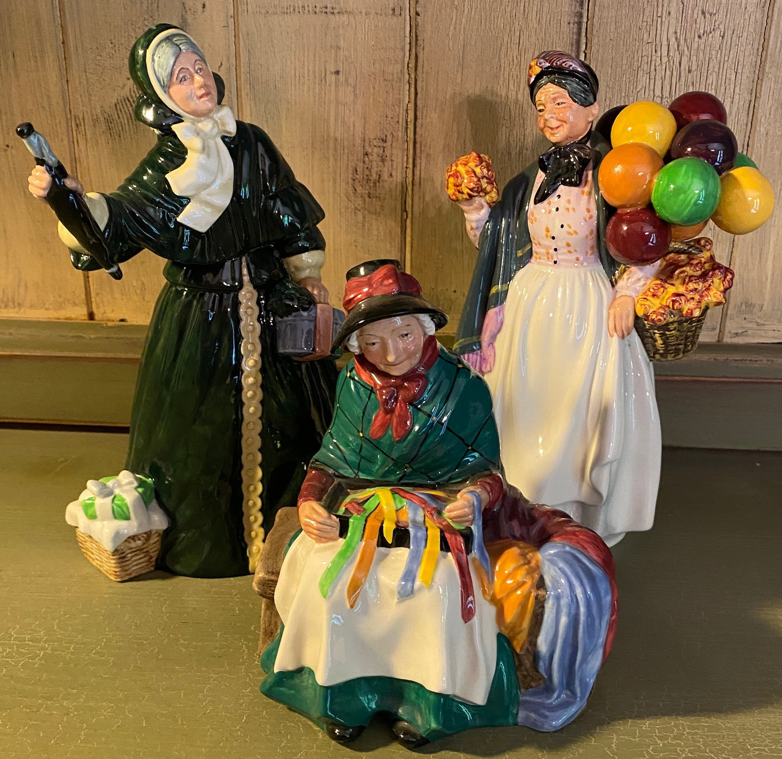 Three Royal Doulton Figurines - 'Silks & Ribbons' #HN2017, 'Biddy Pennyfarthing' #HN1843, 'Christmas (1 of 10)