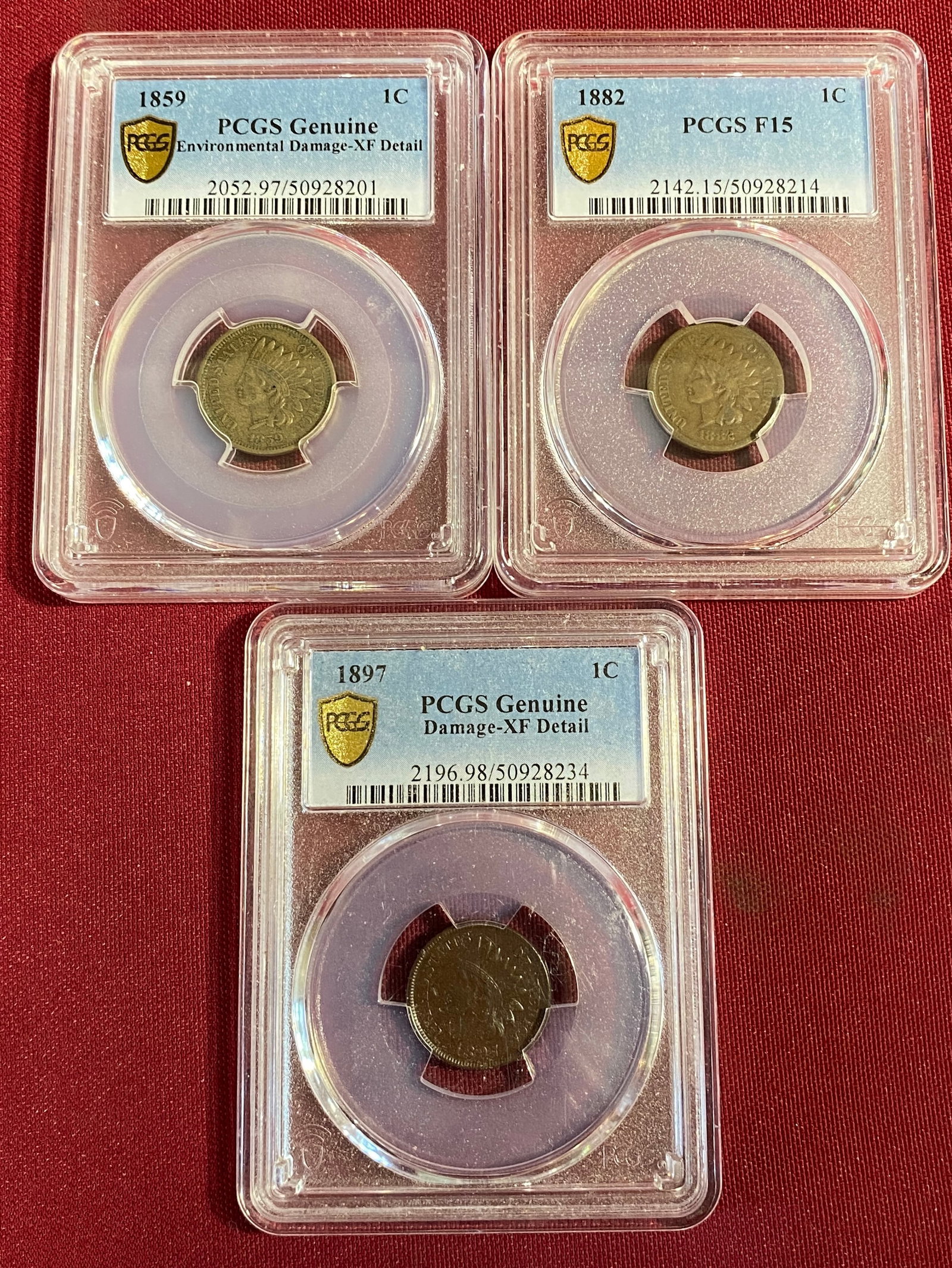 Three PCGS Graded Indian Head Pennies - 1859 XF Details (Genuine - Environment Damage), 1882 F15,: Three PCGS Graded Indian Head Pennies - 1859 XF Details (Genuine - Environment Damage), 1882 F15, 1897 XF Details (Genuine - Damage)