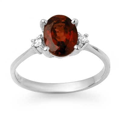 Certified 1.54ctw Garnet & Diamond Ring White Gold: Lot no.: 90120 BRAND NEW , GENUINE 1.54 CTW GARNET & DIAMOND RING IN 10KT WHITE GOLD GEMSTONE: 1 OVAL CUT GARNET 1.51 ctw DIAMOND: 2 ROUND CUT 0.03 ctw CLARITY: SI3-I2 COLOR: H-K GOLD: 1.8 GRAMS RING 