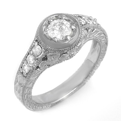 Solitaire 0.70ctw Diamond Engagement Anniversary Ring: Lot no.: 99074A BRAND NEW, GENUINE 0.70 CTW DIAMOND ENGAGEMENT ANNIVERSARY RING CENTER DIAMOND: 1 BRILLIANT CUT 0.45 ctw DIAMOND ACCENT: 6 ROUND CUT 0.25 ctw CLARITY: SI3-I1 COLOR: H-K GOLD: APPROXIMA