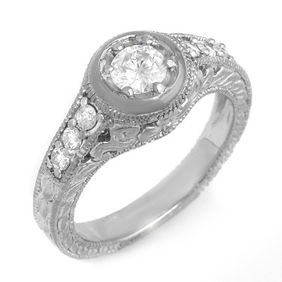 Solitaire 0.70ctw Diamond Engagement Anniversary Ring: Lot no.: 99074A BRAND NEW, GENUINE 0.70 CTW DIAMOND ENGAGEMENT ANNIVERSARY RING CENTER DIAMOND: 1 BRILLIANT CUT 0.45 ctw DIAMOND ACCENT: 6 ROUND CUT 0.25 ctw CLARITY: SI3-I1 COLOR: H-K GOLD: APPROXIMA