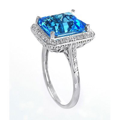GENUINE 6.13 ctw DIAMOND and BLUE TOPAZ RING 14K WHITE : Diamond count: 24 Round cut Diamond weight: 0.13 CT Diamond Color & Clarity: I/ SI1-SI2Gemstone count: 1 Octagon cut BLUE TOPAZ@ 6 CT Gemstone quality: AA Metal: 14K WHITE GOLD Approx. 3.9 grams Dimen