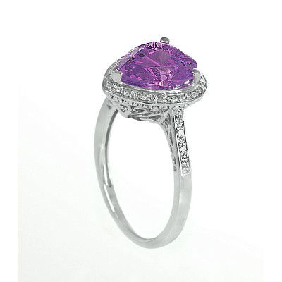 GENUINE 3.13 ctw DIAMOND and AMETHYST RING 14K WHITE GO: Diamond count: 24 Round cut Diamond weight: 0.13 CT Diamond Color & Clarity: I/ SI1-SI2Gemstone count: 1 Pear cut AMETHYST @ 3 CT Gemstone quality: AA Metal: 14K WHITE GOLD Approx. 3 grams Dimension: