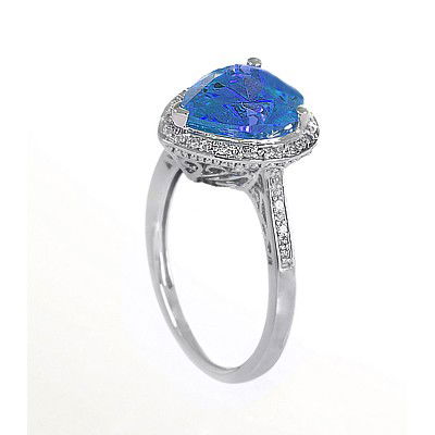 GENUINE 3.13 ctw DIAMOND and BLUE TOPAZ RING 14K WHITE : Diamond count: 24 Round cut Diamond weight: 0.13 CT Diamond Color & Clarity: I/ SI1-SI2Gemstone count: 1 Pear cut BLUE TOPAZ@ 3 CT Gemstone quality: AA Metal: 14K WHITE GOLD Approx. 3 grams Dimension: