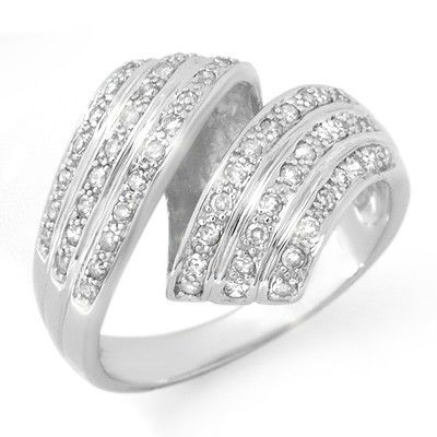 Natural 0.70 ctw Diamond Ring 10K White Gold: Diamond: 58 Round cut @ 0.70 ctw Clarity: SI-I Color: H-KMetal Purity & Color : 10K Gold-WhiteGold weight: 5.70 gramsRing size (US): 6Dimension: Approx. 3/4" x 5/8"This ring can be re-size for an addi