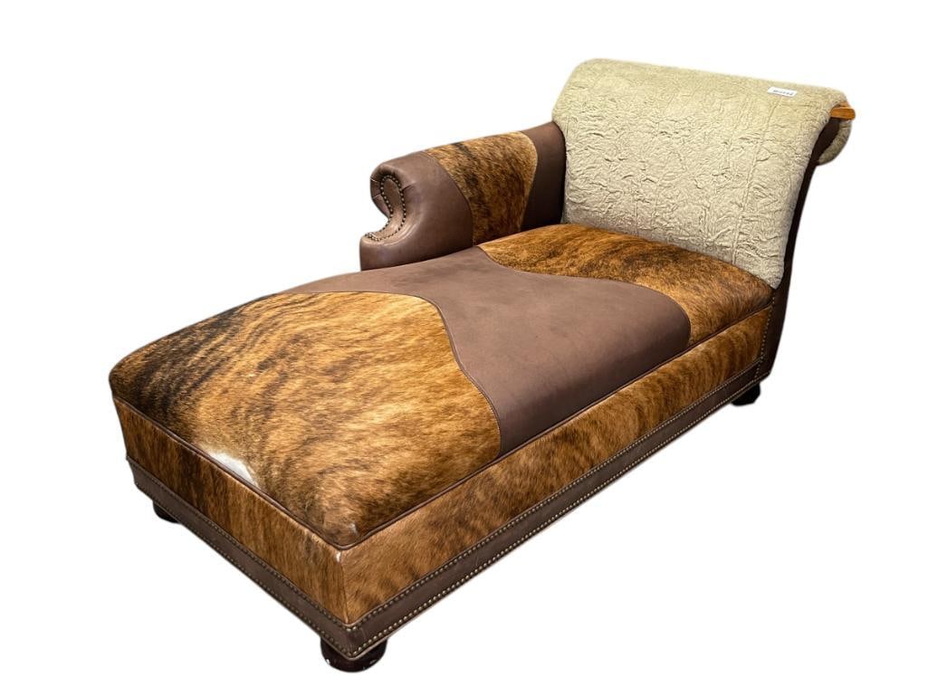 CUSTOM MADE RANCHERS COWHIDE AND LEATHER CHAISE LOUNGE: FEATURING INCREDIBLE COWHIDE UPHOLSTERY PERFECT FOR A WESTERN THEME, COTTON BACK, RIGHT SIDE ARM REST 64" X 28" X 17" SEAT HEIGHT