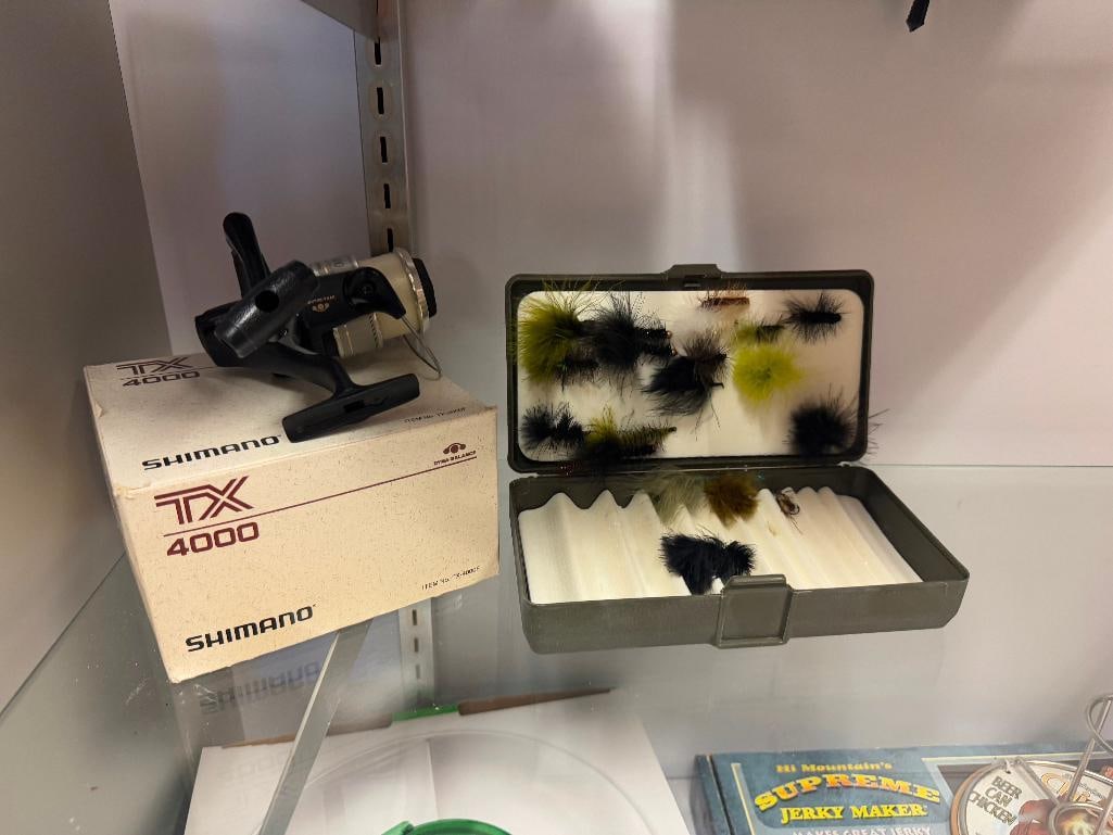 SHIMANO TX4000 QUICJ FIRE II SPINNING REEL AND HAND TIED FLIES: REEL INCLUDES ORIGINAL BOX AND HAND TIED FLIES ARE IN CASES