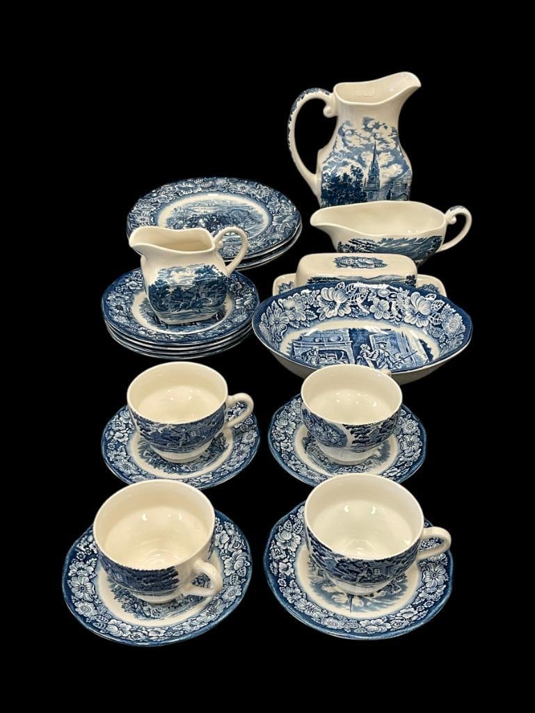 ENGLISH STAFFORDSHIRE LIBERTY BLUE CHINA WITH HISTORICAL COLONIAL SCENES: OVER 20 PIECES INCLUDING PITCHER, GRAVY BOAT, SERVING BOWL, PLATES, SAUCERS, AND CUPS, ALL HALLMARKED ON BOTTOMS LARGEST IS 7 1/4" PITCHER