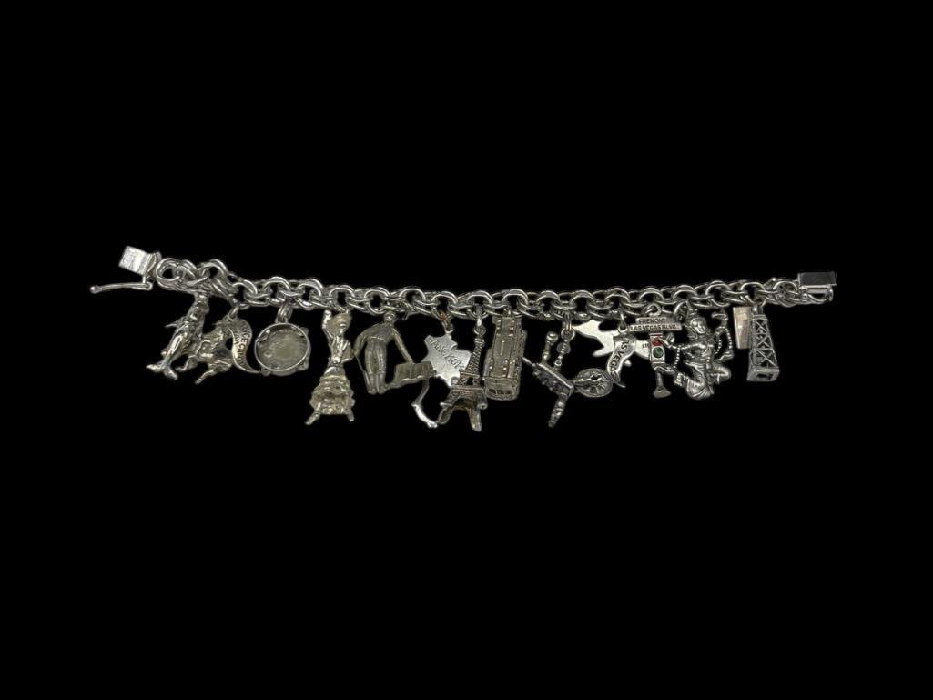 VINTAGE STERLING SILVER TRAVELER'S CHARM BRACELET FEATURING VARIOUS LANDMARK THEMED CHARMS (1 of 8)