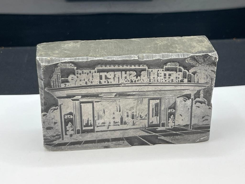 PETER B. SHEPTENKO "THE PIONEER REALTY COMPANY..." METAL STAMP: APPEARS TO SHOW STORE FRONT WITH STREET NUMBER "475" 3 1/4"