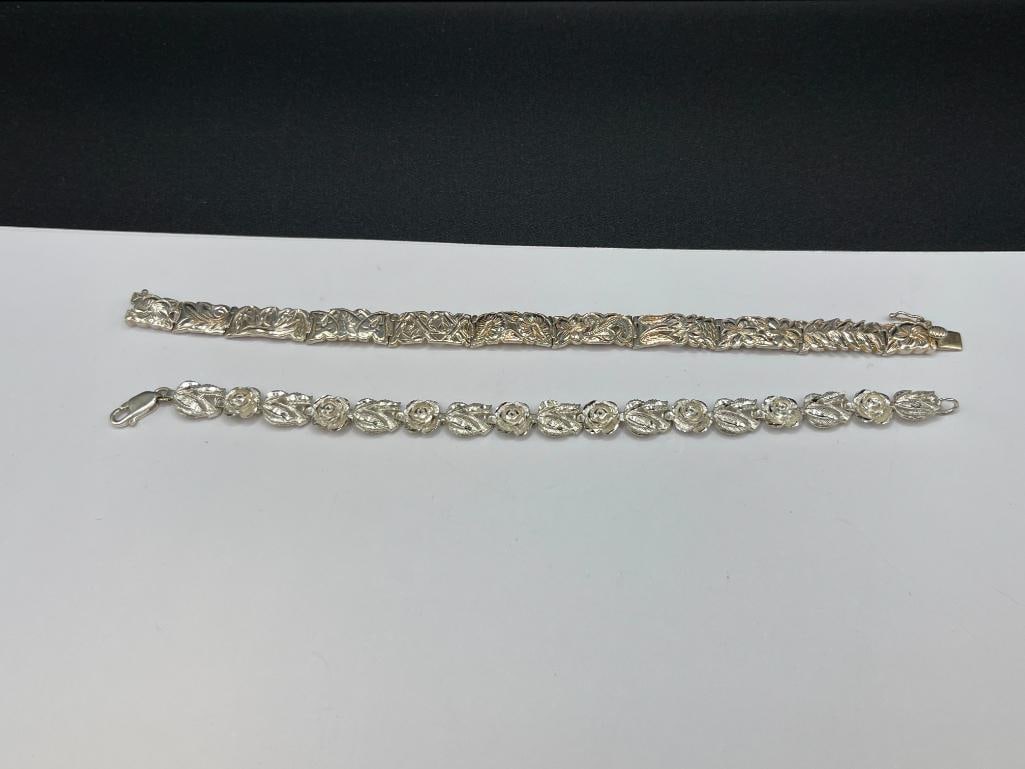 TWO STERLING SILVER FLORAL LINK BRACELETS: 7 1/4" EACH, 26.05 GRAMS TOTAL