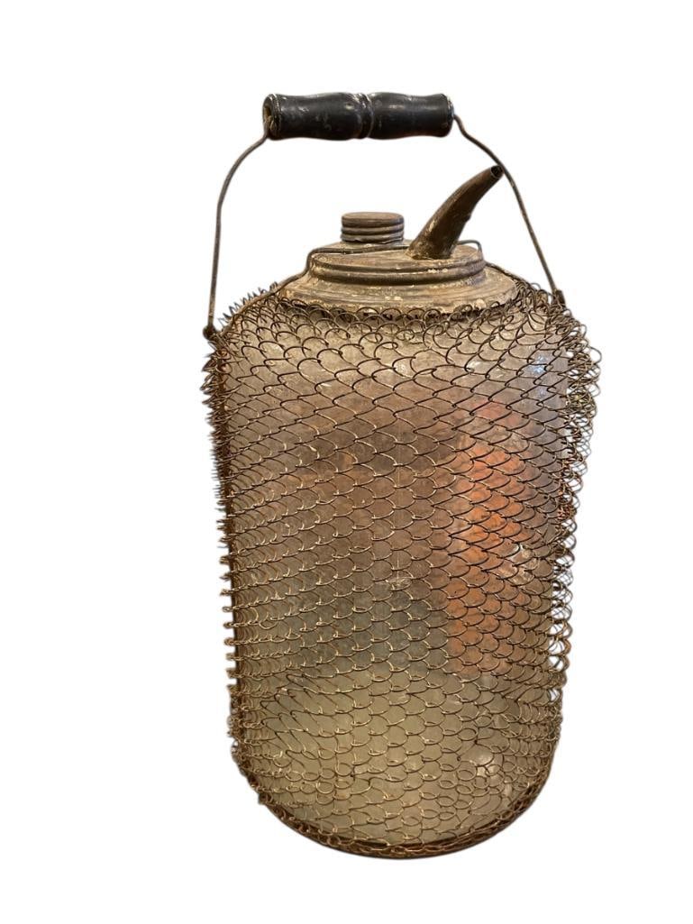 ANTIQUE 1990'S GLASS AND METAL WIRE MESH KEROSENE OIL BOTTLE 1 GALLON WITH METAL SPOUT (1 of 6)