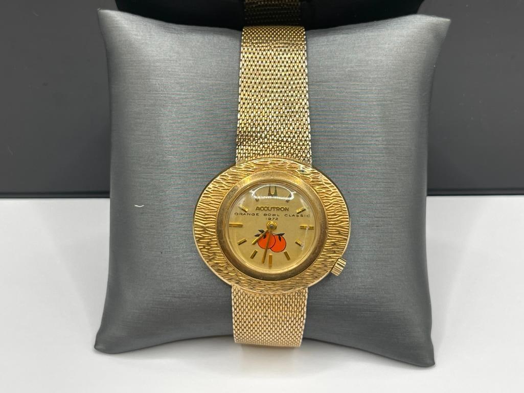 1972 ORANGE BOWL CLASSIC COLLEGE FOOTBALL ISSUE ACCUTRON BULOVA 2183 WRISTWATCH: GOLD FILLED CASE AND BAND, NEEDS BATTERY 36MM CASE