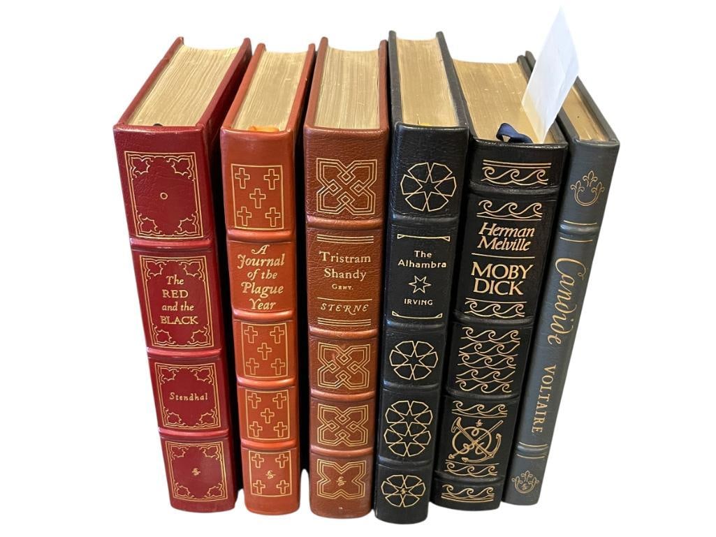 THE EASTON PRESS COLLECTOR'S EDITION LEATHER BOUND BOOKS: LEATHER BOUND BOOKS WITH GILT EMBOSSED LETTERING, MOBY DICK, CANDIDE, THE ALHAMBRA, TRISTRAM SHANDY, A JOURNAL OF THE PLAQUE YEAR, AND THE RED AND THE BLACK EACH APPROX. 7 1/8" X 10 1/2"