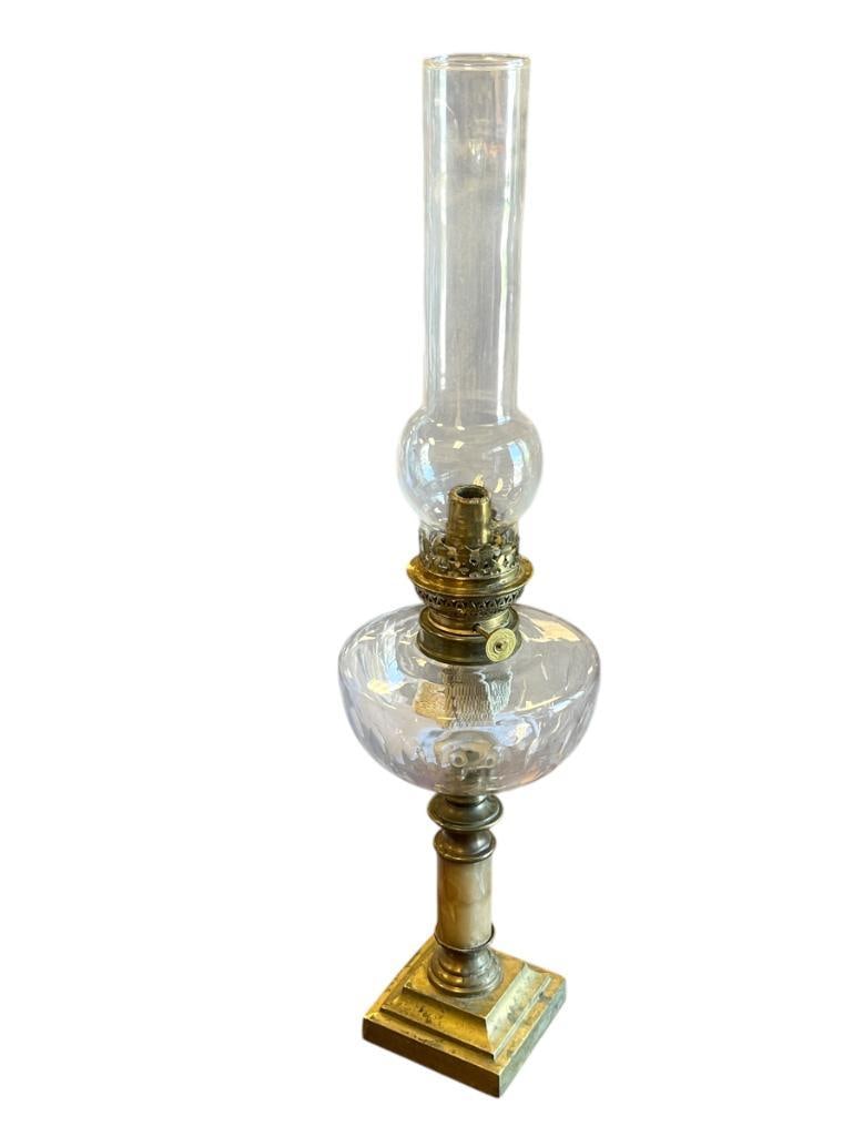 19TH CENTURY ANTIQUE OIL LAMP WITH CUT GLASS FONT, STONE PEDESTAL WITH SQUARE BASE: STEPPED POLISHED BRASS BASE WITH STONE AND BRASS COLUMN, CUT GLASS FONT WITH CLEAR GLASS CHIMNEY 22 3/4" H