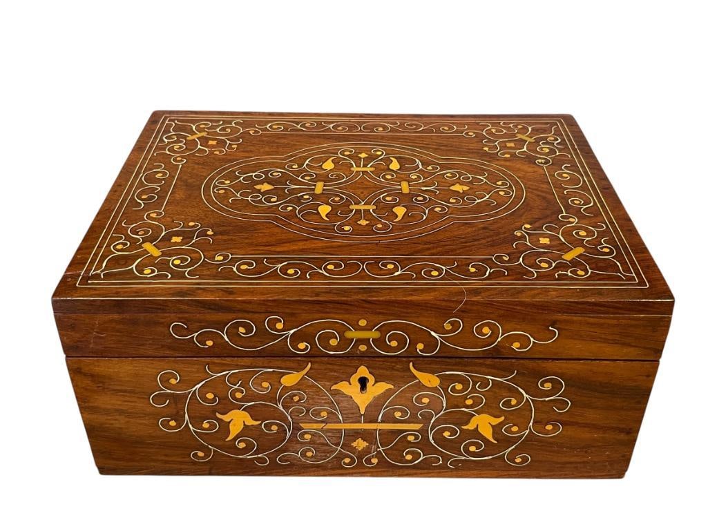 EARLY 20TH CENTURY ROSEWOOD FITTED JEWELRY BOX WITH INTRICATE MARQUETRY BONE AND CELLULOID INLAY: LARGE ROSEWOOD JEWELRY BOX WITH HINGED TOP, SCROLL ART AND LEAF DESIGN MARQUETRY, RED VELVET LINED WITH MIRROR, INCLUDES THREE TRAYS, TWO WHICH ARE REMOVABLE, EACH TRAY IS FITTED TO STORE RINGS, NECKL