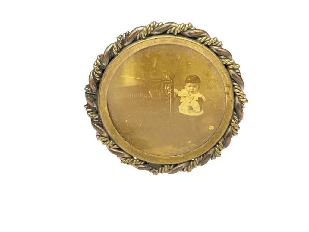 ANTIQUE GOLD FILLED MOURNING BROOCH FEATURING SEPIA TONED PHOTOGRAPH OF INFANT BY CRADLE (1 of 6)